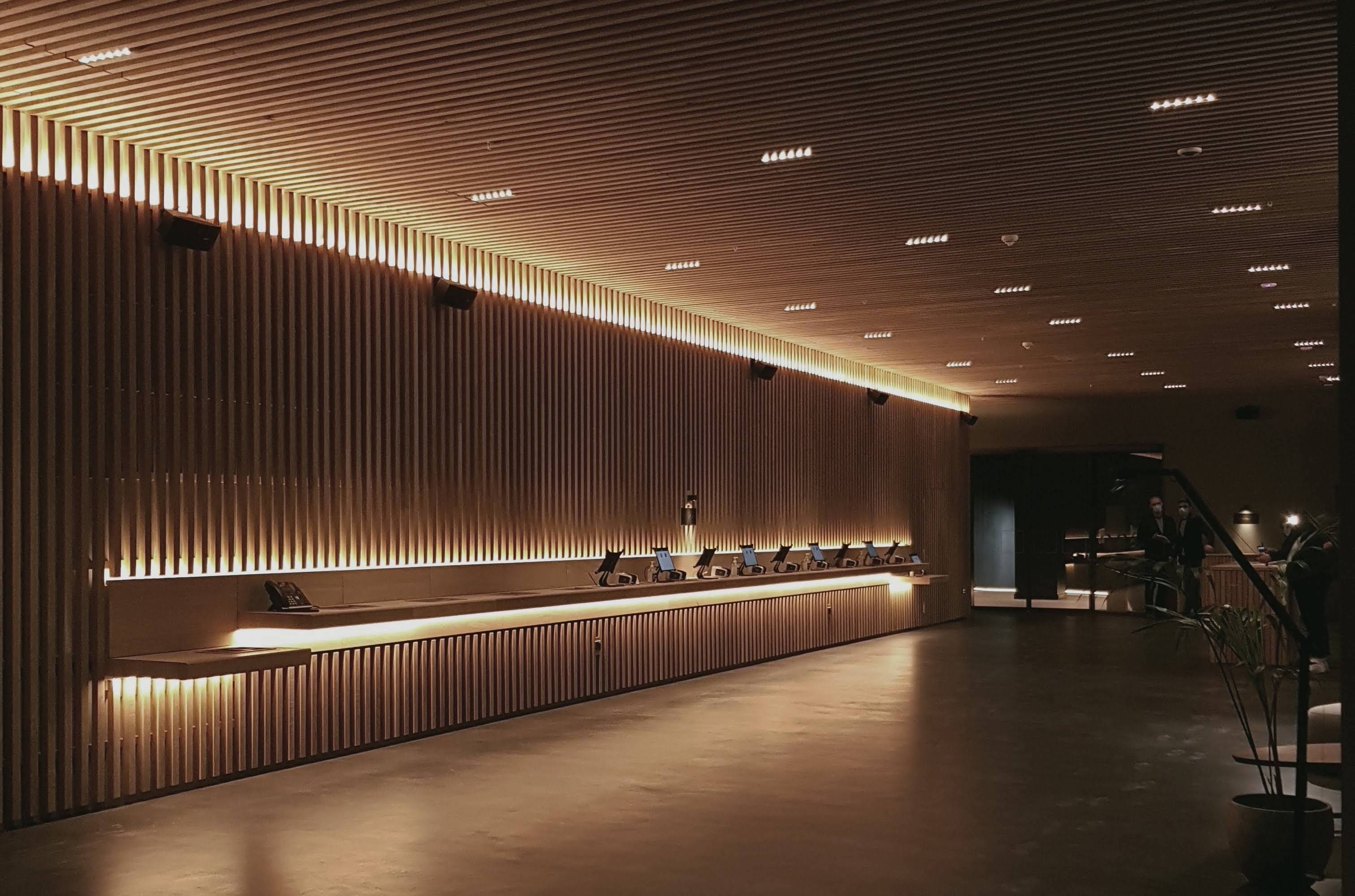 Zedwell Piccadilly London hotel reception with warm architectural LED lighting design