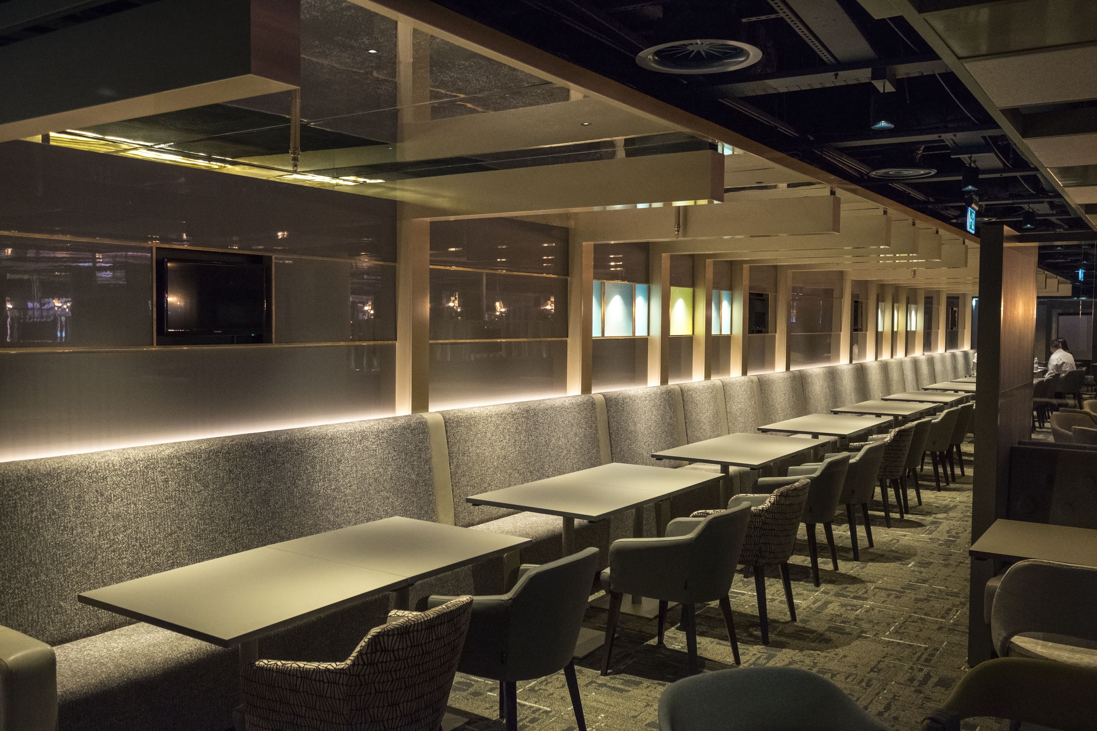 Club Wembley hospitality lounge interior with integrated LED strip lighting along seating and wall panels