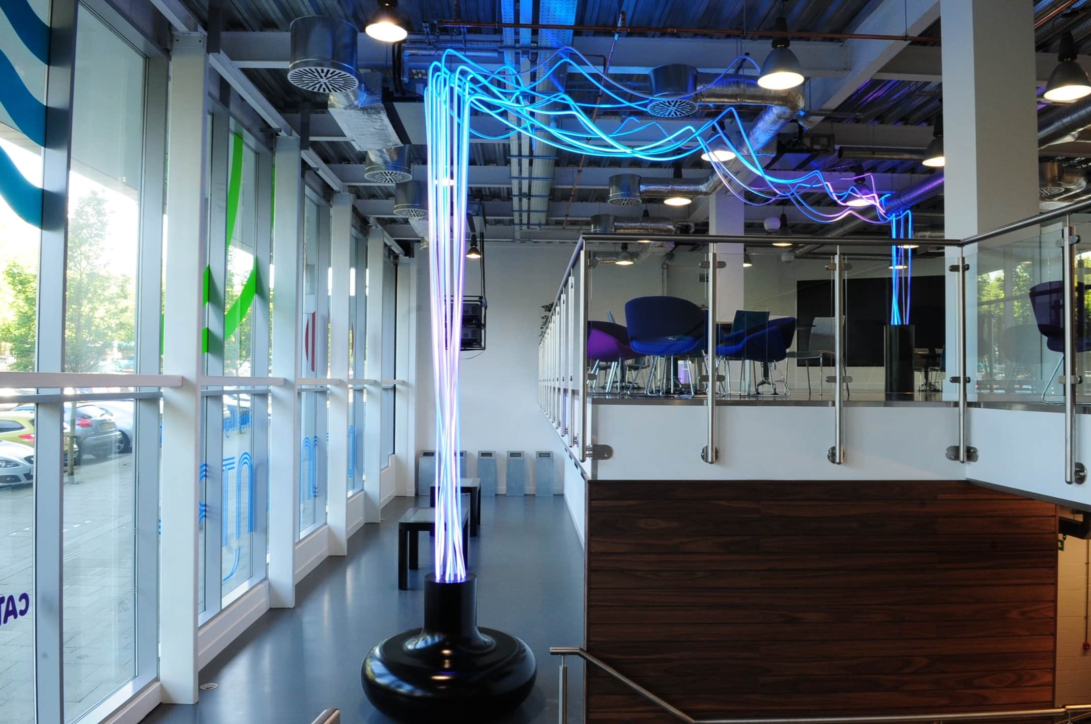 Innovation centre interior with dynamic LED lighting installation representing transport data flow